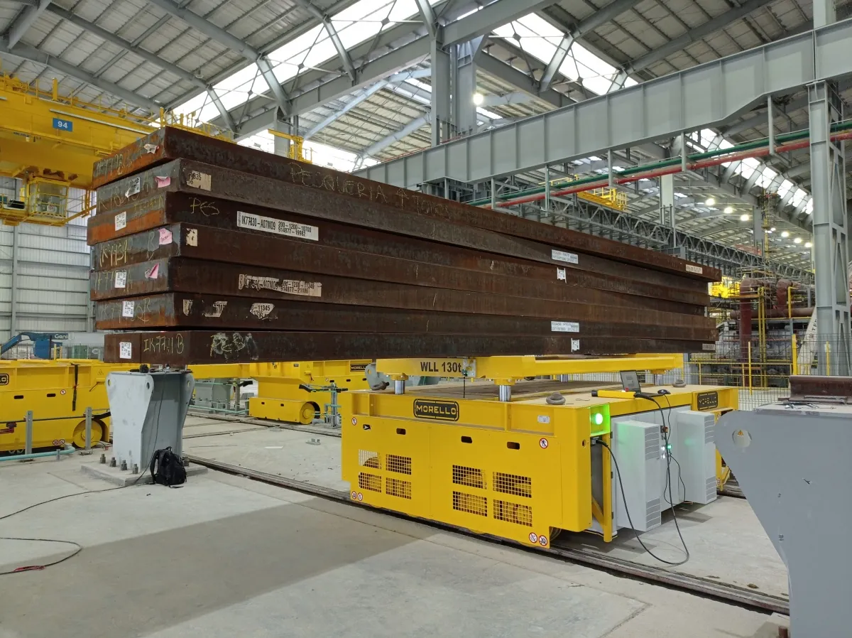 Automatic Morello rail transfer cart carrying steel slabs