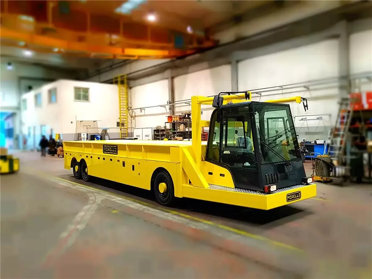 Morello 40 t battery-powered electric platform truck with driver cab inside a plant