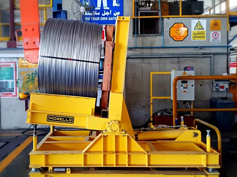 Morello 4 t coil tilter with load cells turning a wire coil in a steel plant