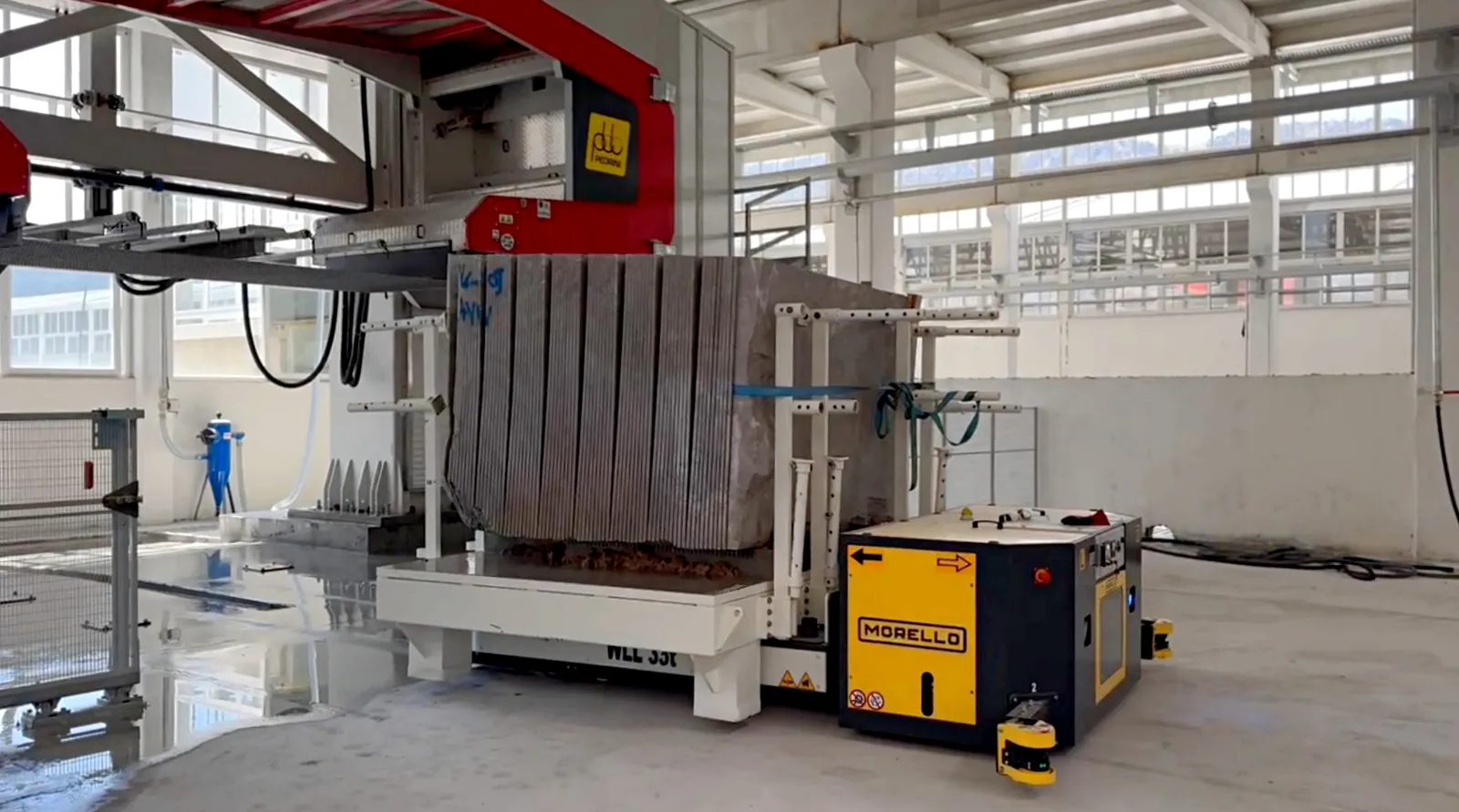 Morello electric pallet truck moving marble slabs in a stone processing plant
