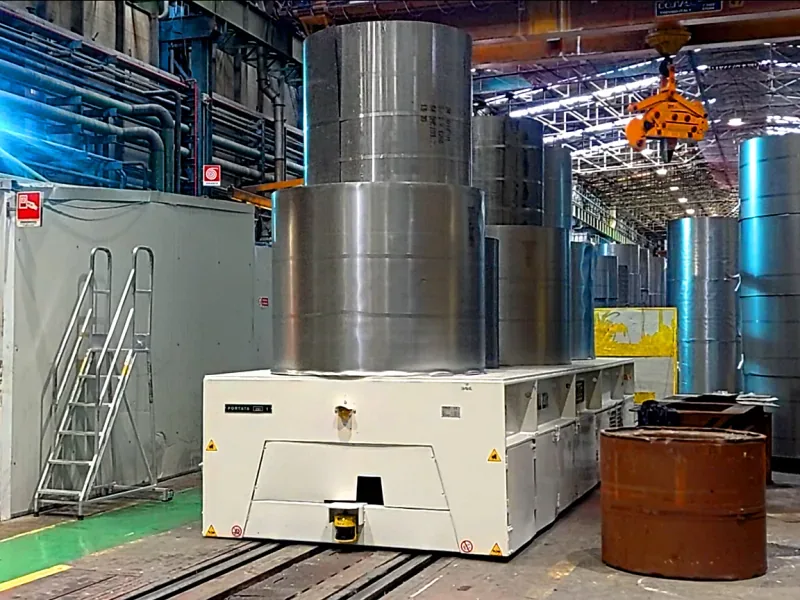 Morello 220 t automatic rail coil cart carrying large steel coils in a mill