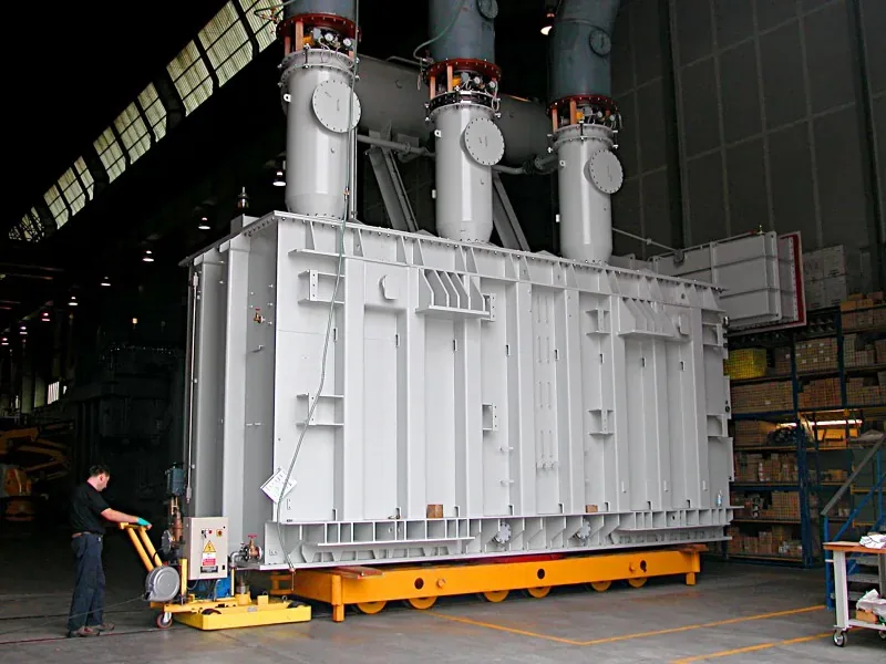 Morello tractor moving a 230 t power transformer on rails in a transformer plant