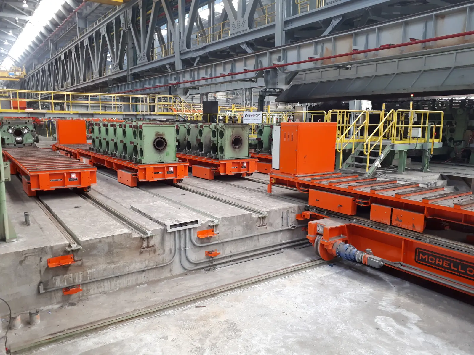 Morello rail transfer carts on tracks in a steel mill