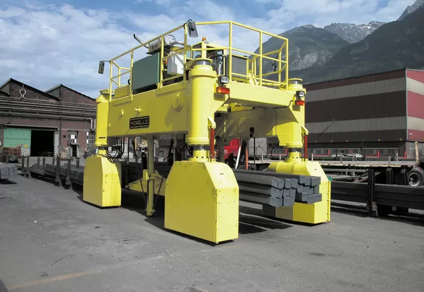 Morello SGD VC 30 t self-loading diesel straddle transporter carrying steel bars