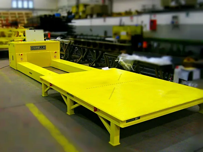 Morello 20 t electric pallet trolley with single low loading bed slid under a yellow steel pallet