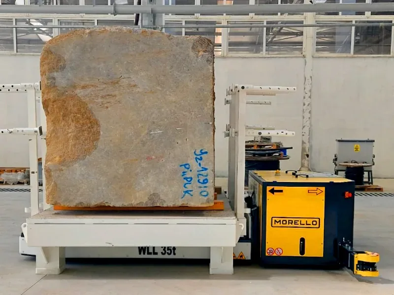 Morello 35 t electric pallet truck lifting a natural stone block on a steel pallet