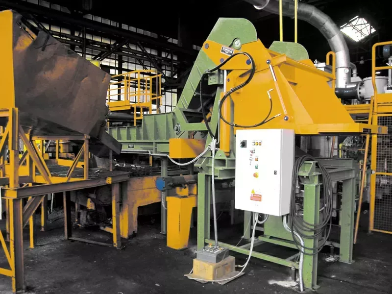 Morello 180 degree tilter with conveyor belt installed in a foundry line