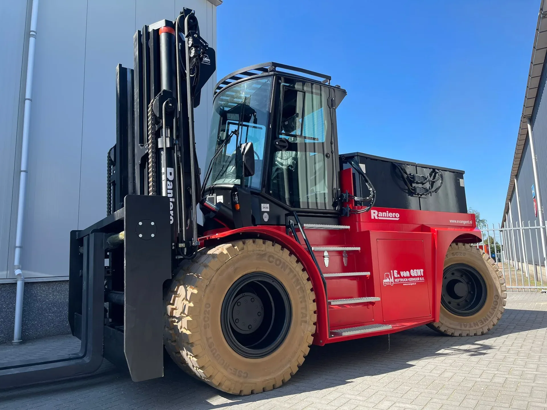 Raniero AC200 extra-heavy electric forklift with large tires and cab, parked outdoors
