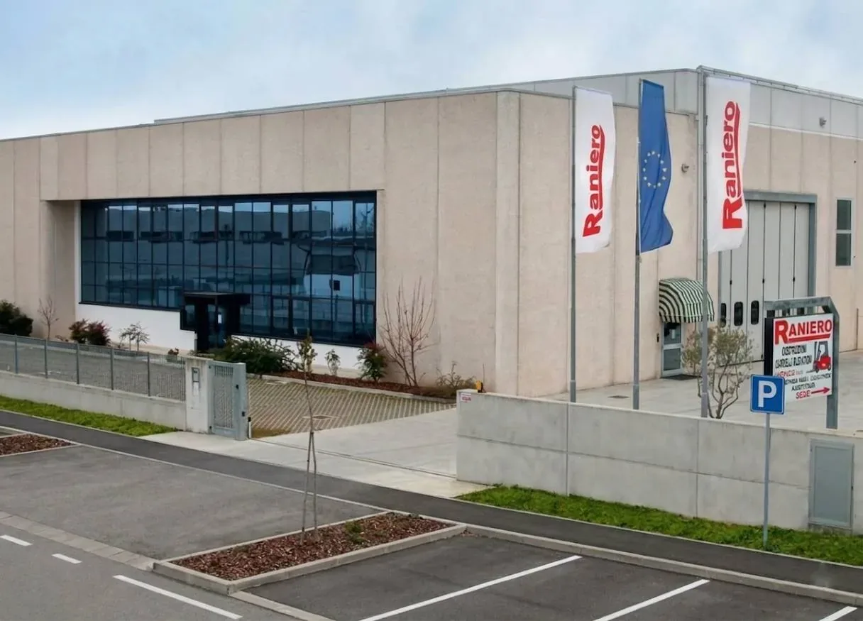 Raniero forklift headquarters and production plant in Italy, exterior view with company flags
