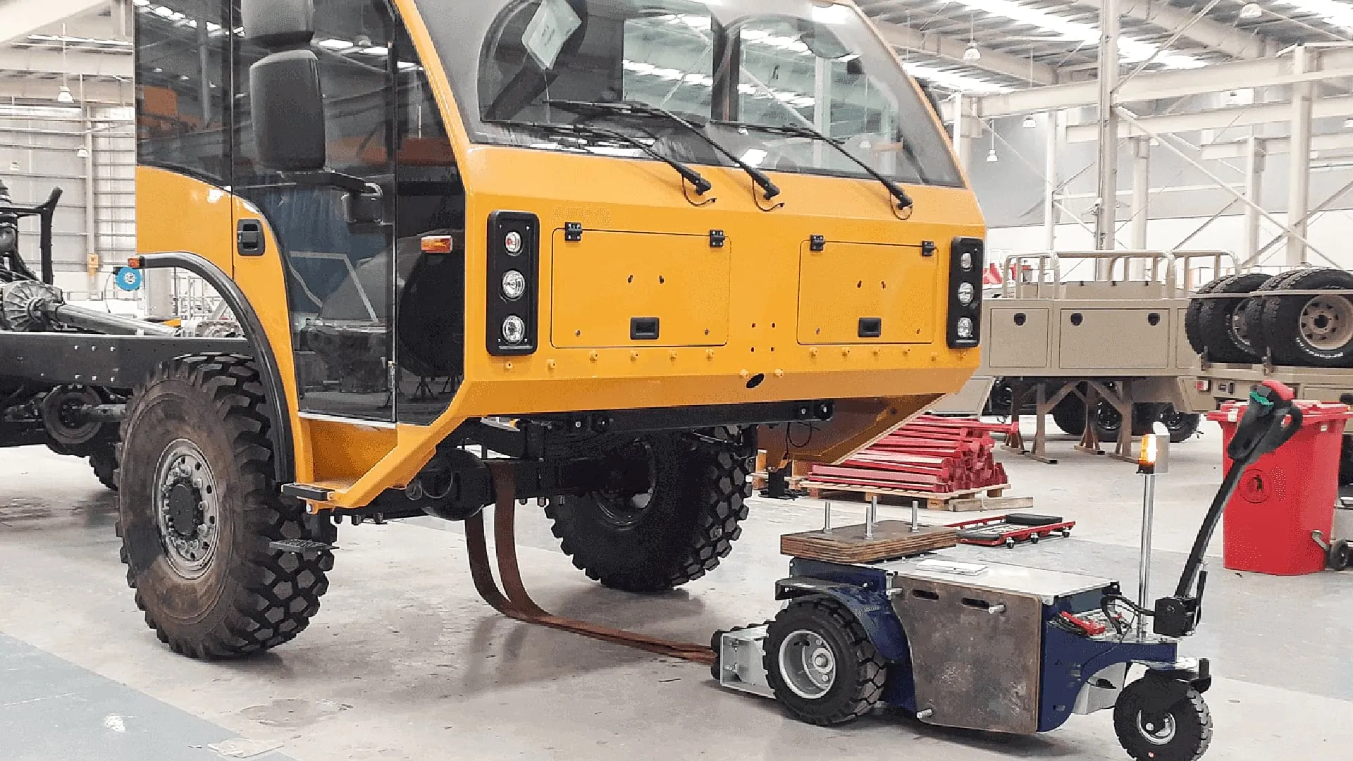 Zallys M10 electric mover moving a truck along the production line